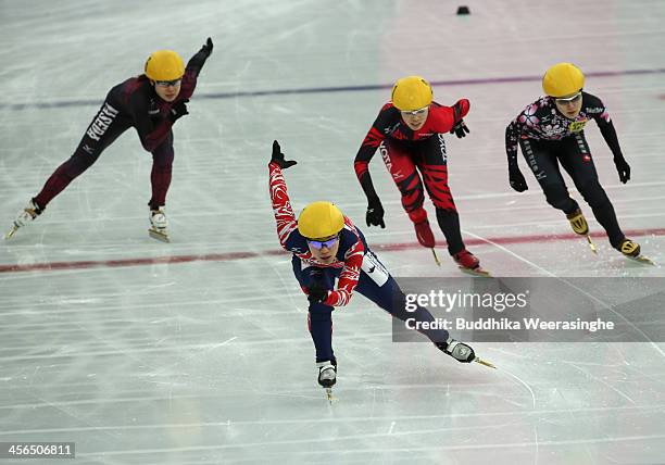 Yui Sakai, front, leads, Ayuko Ito , Biba Sakurai and Moemi Kikuchi complete in the Short Track Skating women 1,000 final during the Short Track...