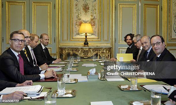French president Francois Hollande and French Foreign Affairs minister Laurent Fabius meet with Finnish prime minister Alexander Stubb at the Elysee...