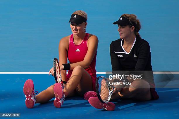 Kristina Mladenovic of France and Anastasia Pavlyuchenkova of Russia, dissatisfied with the referee's decision carry out a protest by sitting down on...