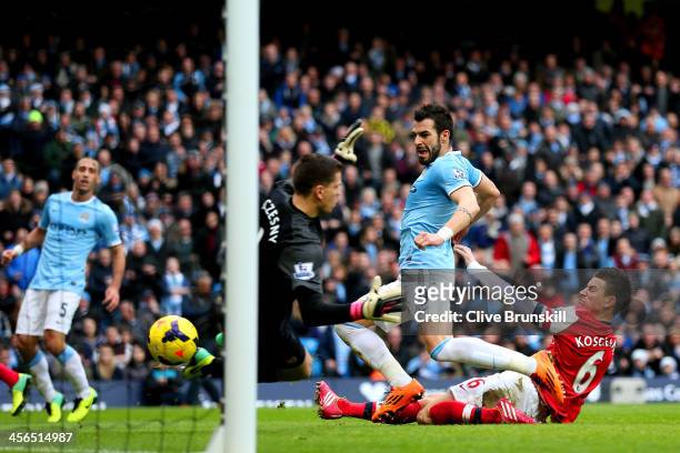 Laurent Koscielny of Arsenal fails to stop Alvaro Negredo of Manchester City scoring their second goal during the Barclays Premier League match...