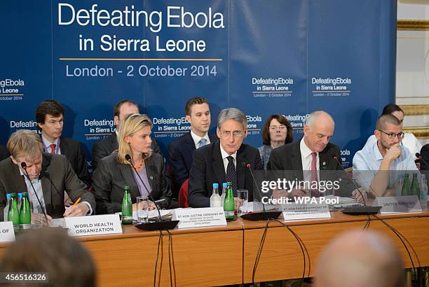 British Foreign Secretary Philip Hammond addresses delegates at the "Defeating Ebola: Sierra Leone" conference at Lancaster House on October 2, 2014...