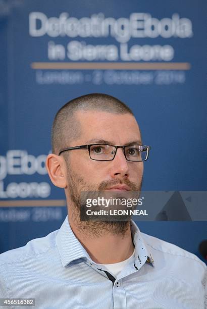 British Ebola survivor William Pooley listens as he attends the "Defeating Ebola: Sierra Leone" conference in central London, on October 2, 2014....