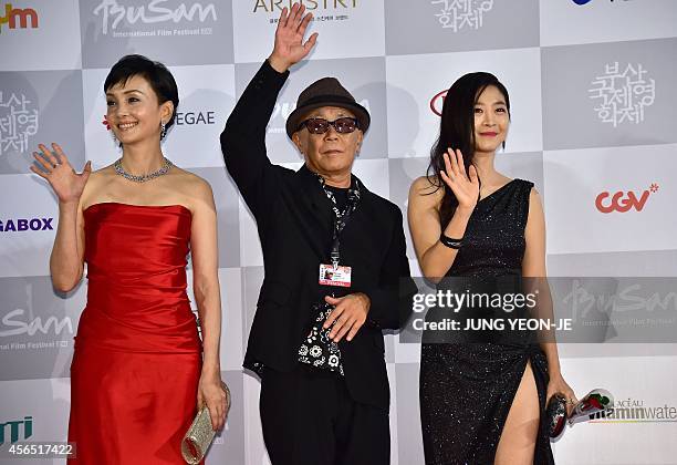 Japanses actress Kaho Minami, director Ryuichi Hiroki and South Korean actress Lee Eun-Ho of "Kabuki Lovehotel" pose on the red carpet for the...