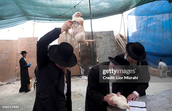 Kaparot Ritual Ultra-Orthodox Jewish men perform the Kaparot ceremony on October 02 ...