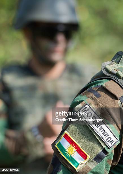 The national flag of Kurdistan is seen on the uniform of a peshmerga fighter during training on October 02, 2014 in Hammelburg, Germany. A total of...