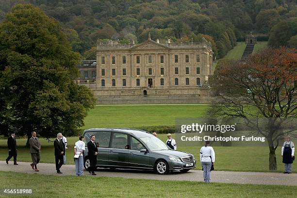 Staff line the route as the funeral cortege of Deborah, Dowager Duchess of Devonshire makes it's way to St Peters Church, Edensor, past Chatsworth...