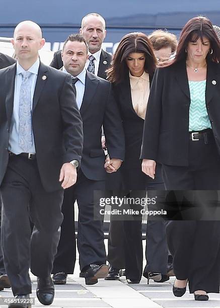 Joe Giudice and wife Teresa Giudice arrive for sentencing at federal court in Newark on October 2, 2014 in Newark, New Jersey.