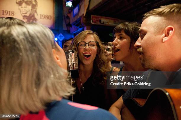 Jess Wolfe of Lucius, Rachel Price and Bridget Kearney of Lake Street Dive and members of their bands perform in the crowd at Tipitina's on October...
