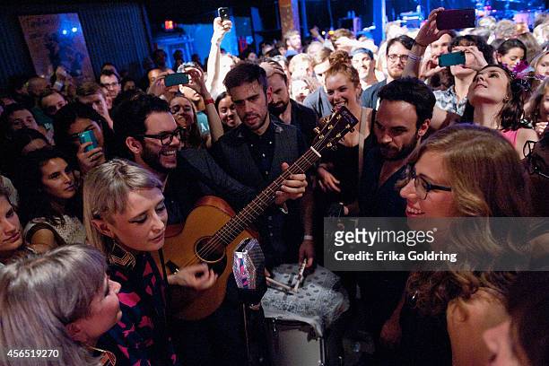 Holly Laessig and Jess Wolfe of Lucius, Rachel Price of Lake Street Dive and members of their bands perform in the crowd at Tipitina's on October 1,...