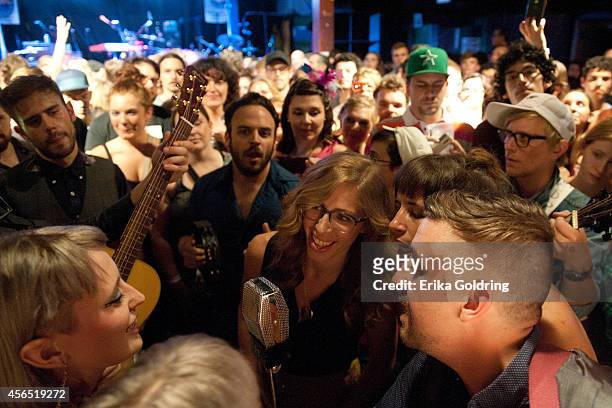 Holly Laessig and Jess Wolfe of Lucius, Rachel Price and Bridget Kearney of Lake Street Dive and members of their bands perform in the crowd at...