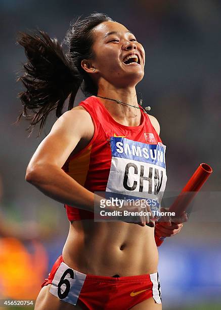 Wei Yongli of China celebrates claiming the Gold medal in the Women's 4x100m Relay Final during day thirteen of the 2014 Asian Games at Incheon Asiad...