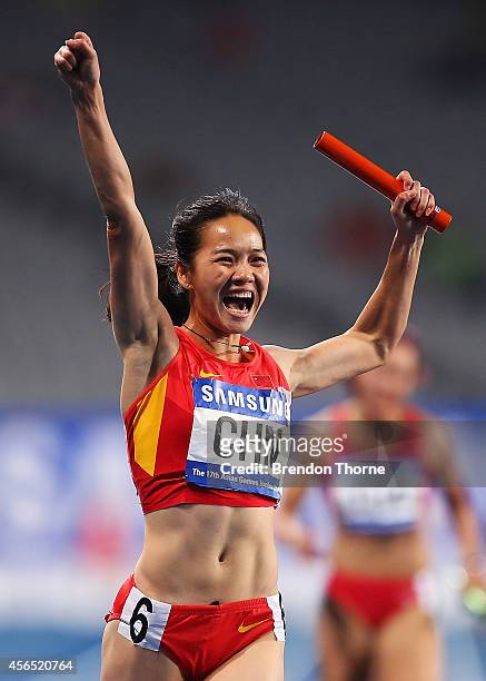 Wei Yongli of China celebrates claiming the Gold medal in the Women's 4x100m Relay Final during day thirteen of the 2014 Asian Games at Incheon Asiad...