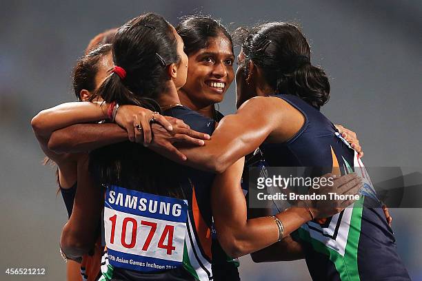 Pawar Priyanka, Lukka Tintu, Kaur Mandeep and Poovamma Raju Machettira of India celebrate claiming the Gold medal in the Women's 4x400m Relay Final...