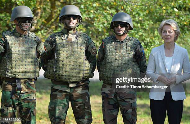 German Defence Minister Ursula von der Leyen is pictured next to peshmerga fighters on October 02, 2014 in Hammelburg, Germany. A total of 32...