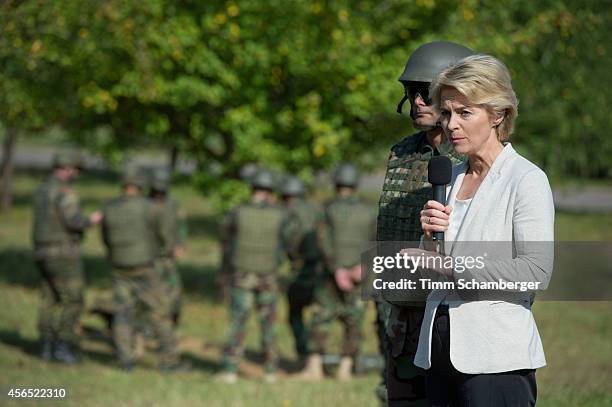 German Defence Minister Ursula von der Leyen speaks next to a peshmerga fighter on October 02, 2014 in Hammelburg, Germany. A total of 32 peshmerga...