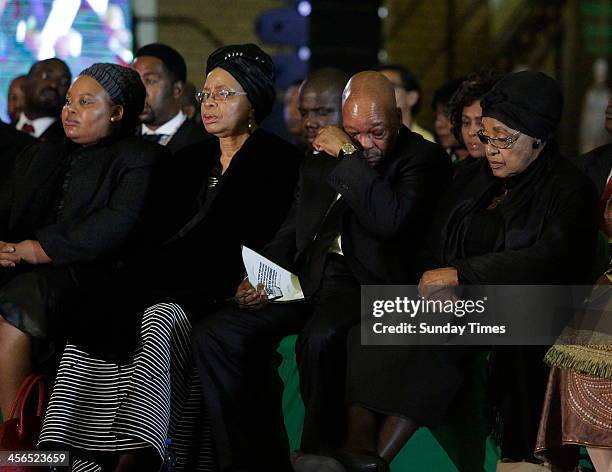 First lady Nompumelelo Ntuli, Graca Machel, President Jacob Zuma and Winnie Madikizela-Mandelaat the official send-off for Nelson Mandela at the...