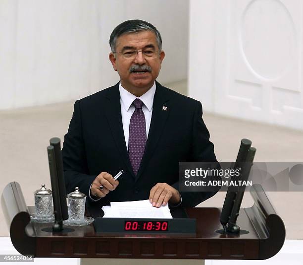 Turkey's Defence Minister Ismet Yilmaz talks during a debate of a motion submitted by the government seeking a green light for the use of Turkish...