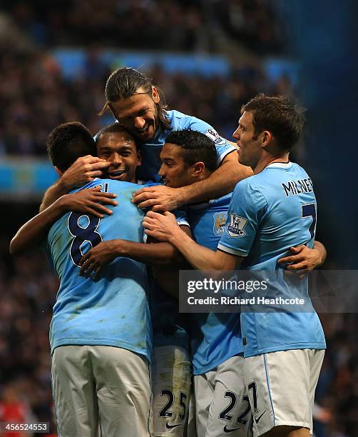 Fernandinho of Manchester City celebrates scoring their fifth goal during the Barclays Premier League match between Manchester City and Arsenal at...