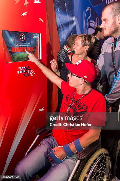 Visitors are seen in the showroom during the Unicredit UEFA Champions League Trophy Tour on October 2, 2014 in Vienna, Austria.