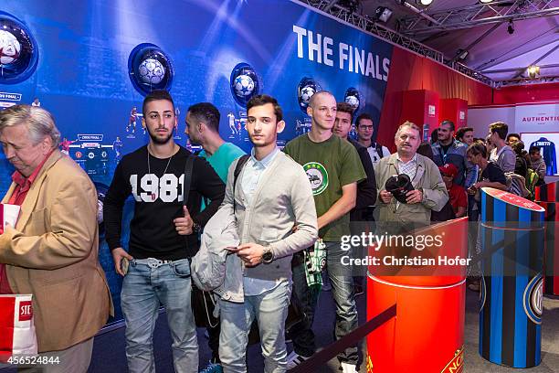 Visitors are seen gathering in the showroom during the Unicredit UEFA Champions League Trophy Tour on October 2, 2014 in Vienna, Austria.