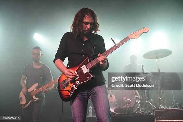 Bass player David Hartley, singer/guitarist Adam Granduciel and drummer Patrick Berkery of War on Drugs performs at the Glass House on October 1,...