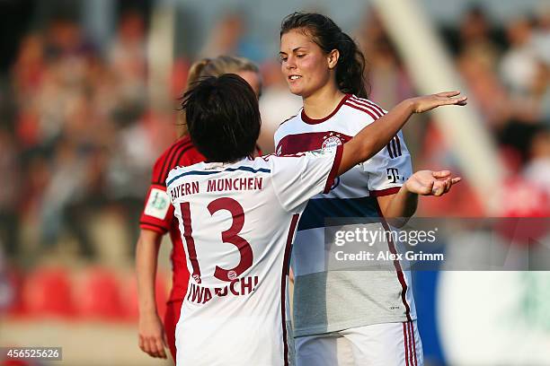 Katherine Stengel of Muenchen celebrates her team's second goal with team mate Mana Iwabuchi during the Allianz Frauen-Bundesliga match between Bayer...