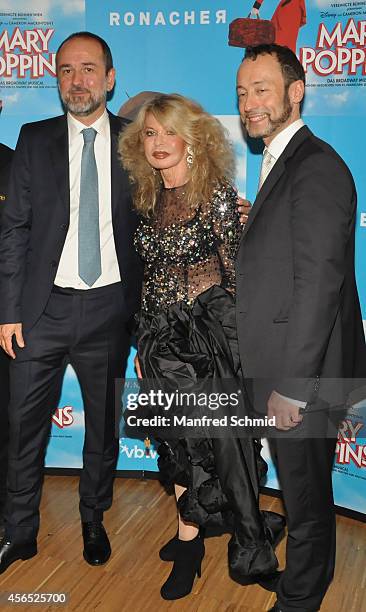 Thomas Drozda, Jeannine Schiller and Christian Struppeck pose for a photograph during the Mary Poppins musical premiere at Ronacher Theater on...