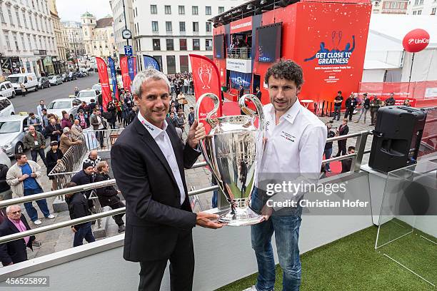 Champions League Trophy is presented to the public by UEFA Ambassador Michael Konsel and UEFA Ambassador Mark van Bommel on a special bus in the...