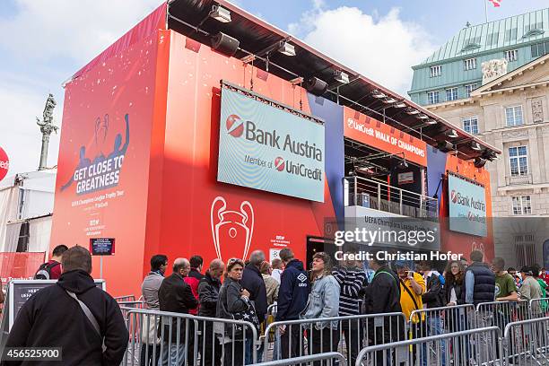 Visitors are seen gathering in front of the central venue to see the Unicredit UEFA Champions League Trophy Tour on October 2, 2014 in Vienna,...