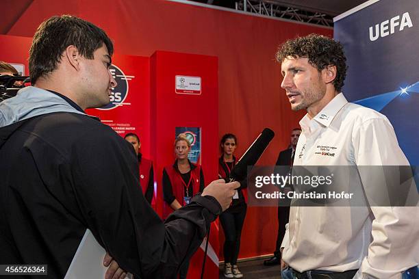 Ambassador Mark van Bommel is interviewed after the press conference prior to the Unicredit UEFA Champions League Trophy Tour on October 2, 2014 in...