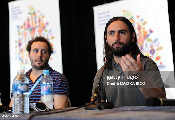 Argentinian Diego Lerman director of "Refugiado" listens on as Colombian film maker Franco Lolli speaks about his movie "Gente de bien" during a...