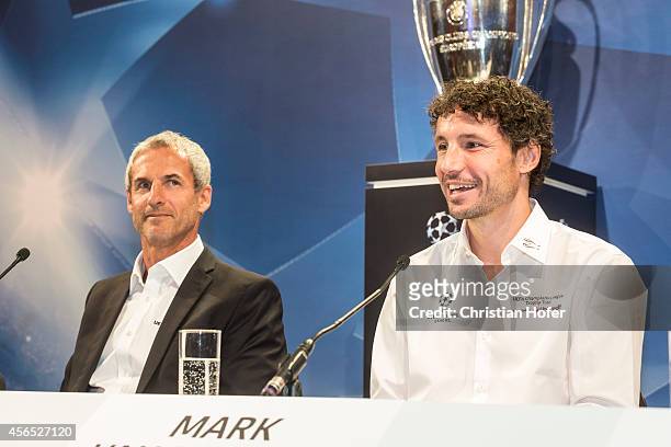 Ambassador Michael Konsel and UEFA Ambassador Mark van Bommel attend the press conference prior to the Unicredit UEFA Champions League Trophy Tour on...
