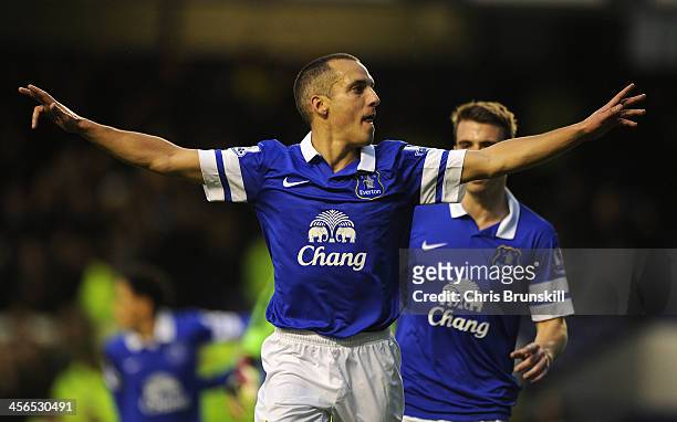 Leon Osman of Everton celebrates scoring the opening goal during the Barclays Premier League match between Everton and Fulham at Goodison Park on...