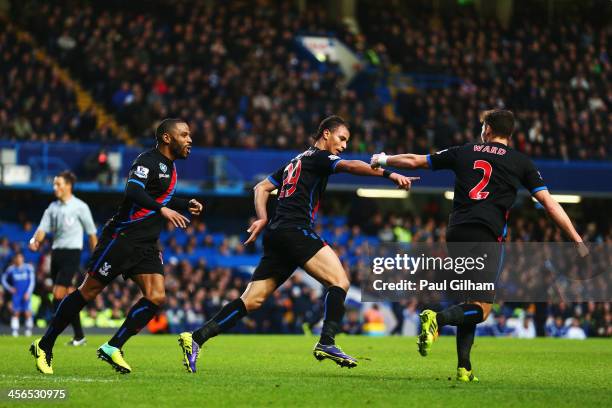 Marouane Chamakh of Crystal Palace celebrates with team mates after scoring during the Barclays Premier League match between Chelsea and Crystal...