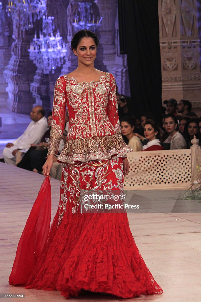 Indian Pakistani Ramp Model Models walk on a ramp to present the creations of a famous Pakistani ...