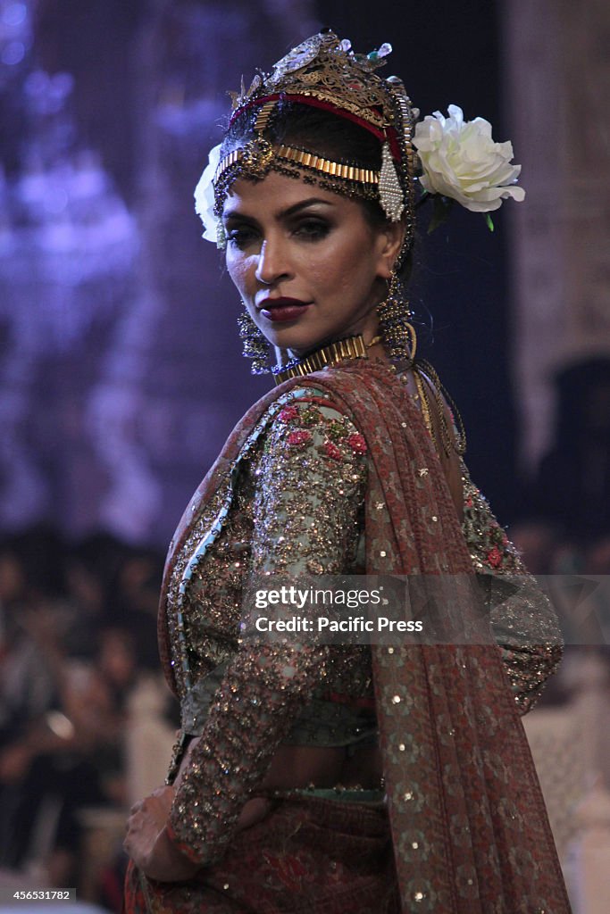 Pakistani Model Ramp Models walk on a ramp to present the creations of a famous Pakistani ...
