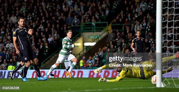 Kris Commons of Celtic scores the first goal during the UEFA Europa League group D match between Celtic and Dinamo Zagreb at Celtic Park on October...