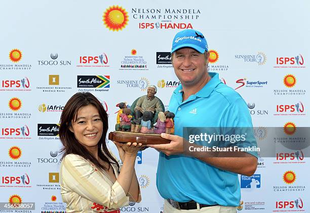 Dawie Van Der Walt of South Africa is presented with the trophy by Midori Miyazaki, ISPS international executive director ,after the Nelson Mandela...