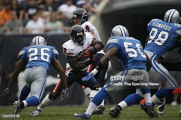 Ernie Sims and Kenoy Kennedy of the Detroit Lions makes a gang tackle during a game against the Chicago Bears on September 17, 2006 at Soldier Field...
