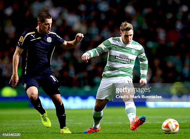 Kris Commons of Celtic takes on Arijan Ademi Dinamo Zagreb during the UEFA Europa League group D match between Celtic and Dinamo Zagreb at Celtic...
