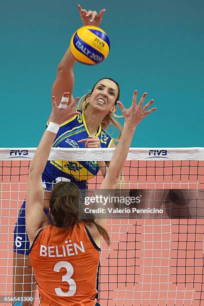 Thaisa Menezes of Brazil spikes as Yvon Belien of Netherlands blocks during the FIVB Women's World Championship pool F match between Brazil and...