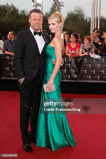 Jenke von Wilmsdorff and Mia Bergmann attend the red carpet of the Deutscher Fernsehpreis 2014 on October 02, 2014 in Cologne, Germany.