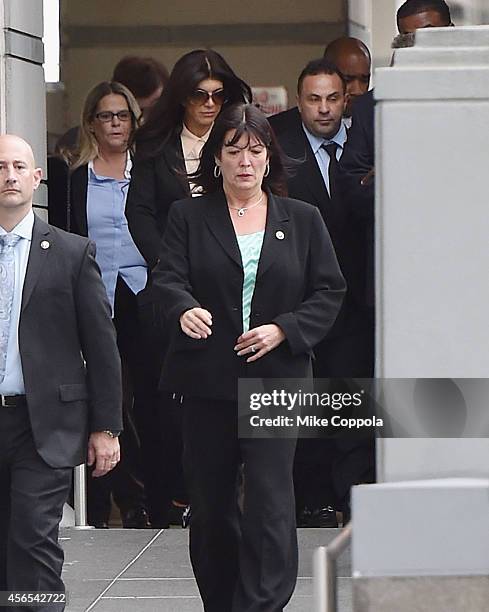 Teresa Giudice and Joe Giudice leave after being sentenced at federal court in Newark on October 2, 2014 in Newark, New Jersey.