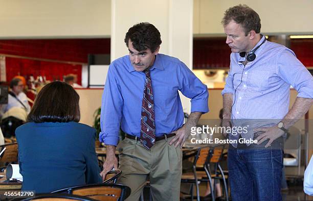 From left, Maureen Keiller , Brian d'Arcy James, and director Tom McCarthy during filming of the "Spotlight" movie in the cafeteria of the Boston...