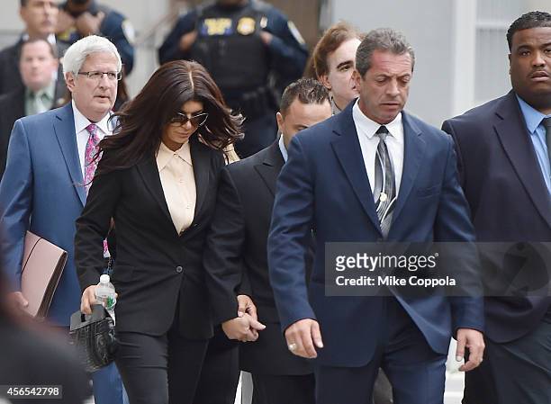 Teresa Giudice and Joe Giudice leave after being sentenced at federal court in Newark on October 2, 2014 in Newark, New Jersey.
