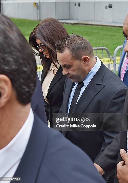 Teresa Giudice and Joe Giudice leave after being sentenced at federal court in Newark on October 2, 2014 in Newark, New Jersey.