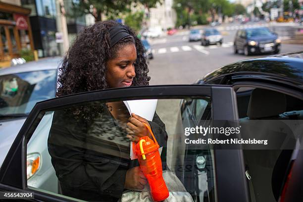 Kiana McWeay, 20 years, gets into a taxi July 10, 2014 to head to a hearing at the City Council meeting in Washington, DC. Kiana, a child...