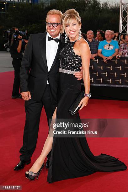 Robert Geiss and Carmen Geiss attend the red carpet of the Deutscher Fernsehpreis 2014 on October 02, 2014 in Cologne, Germany.