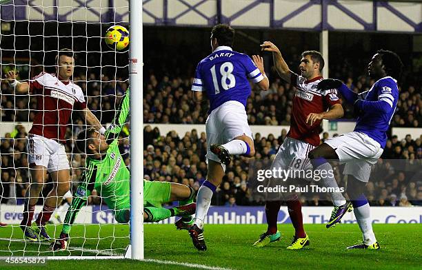 Gareth Barry of Everton scores his team's third goal during the Barclays Premier League match between Everton and Fulham at Goodison Park on December...