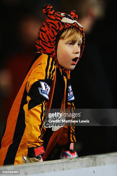 Young Hull City fan prepares to watch the Barclays Premier League match between Hull City and Stoke City at KC Stadium on December 14, 2013 in Hull,...